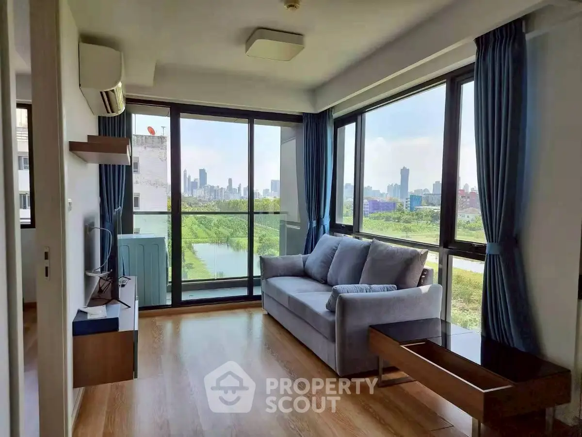 Modern living room with panoramic city view and stylish furniture