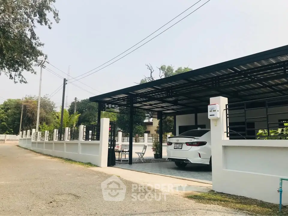 Modern carport with sleek design and spacious driveway in a suburban setting.