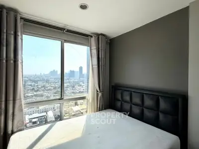 Modern bedroom with city view and large window, perfect for urban living.