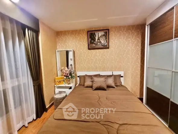 Cozy bedroom with elegant decor and ample natural light