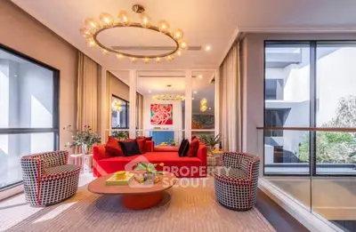 Luxurious modern living room with vibrant red sofa and stylish decor