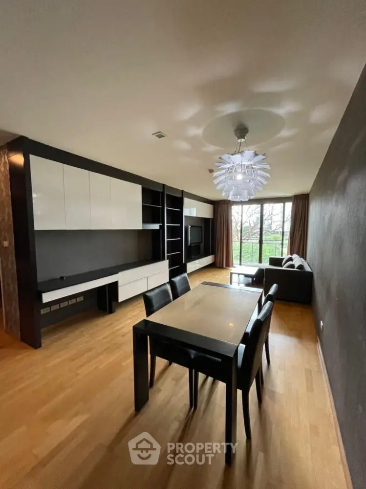 Spacious modern living room with elegant dining area and stylish lighting