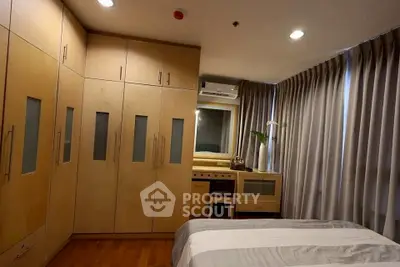 Cozy bedroom with built-in wardrobe and modern decor