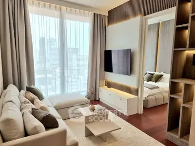 Modern living room with city view, cozy seating, and stylish decor