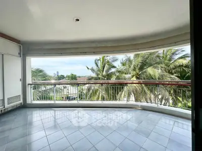 Spacious balcony with stunning tropical view and palm trees