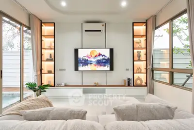 Luxurious modern living room with elegant decor and large windows offering natural light.