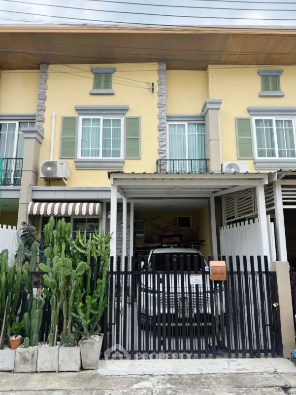 Charming townhouse with gated parking and lush cactus garden