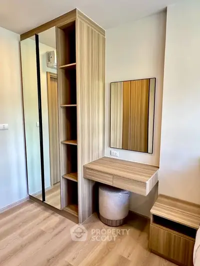 Modern bedroom with stylish wooden wardrobe and vanity set