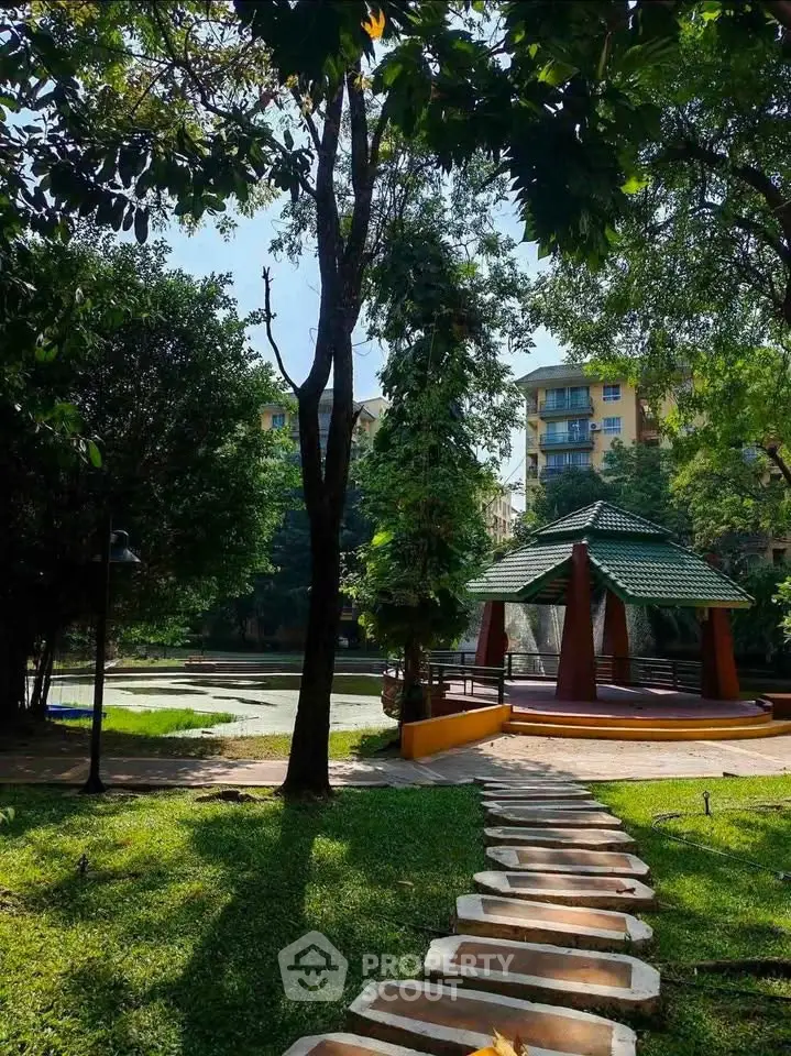 Charming garden view with gazebo and lush greenery in residential complex