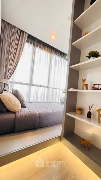 Modern bedroom with floor-to-ceiling windows and stylish decor