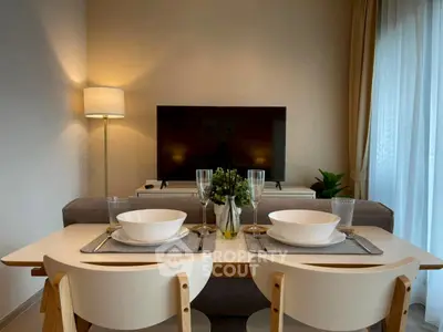 Modern living room with elegant dining setup and cozy lighting