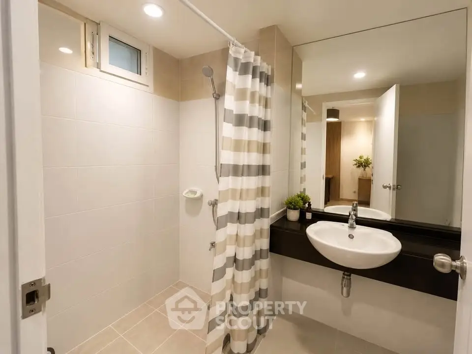 Modern bathroom with sleek design and stylish fixtures in a contemporary home.