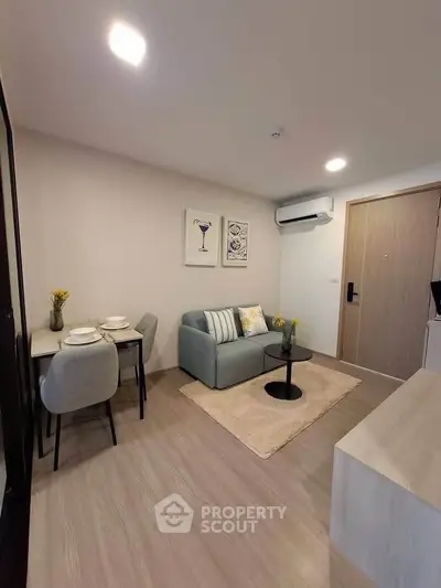 Modern living room with cozy sofa and dining area in stylish apartment