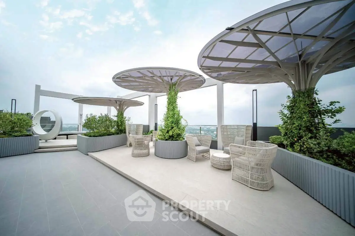 Luxurious rooftop terrace with modern seating and stunning city views.