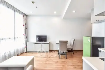 Bright and modern living room with wooden flooring and natural light
