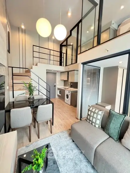 Modern duplex apartment with open living area and stylish kitchen