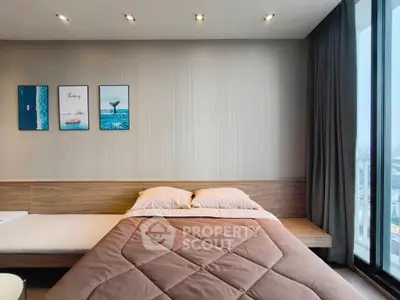 Modern bedroom with large window and stylish decor in urban apartment