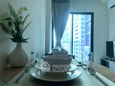 Modern dining setup with city view from balcony in stylish apartment