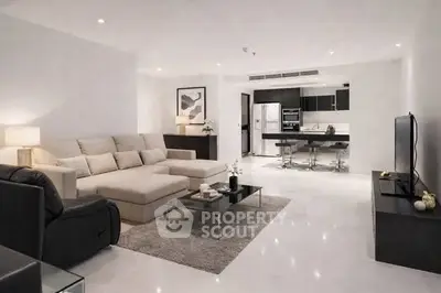 Spacious modern living room with open kitchen and stylish decor