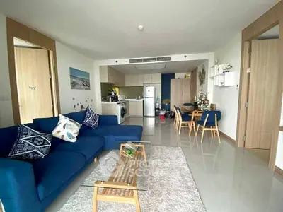 Spacious modern living room with open kitchen and stylish decor
