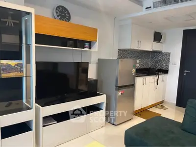 Modern studio apartment with compact kitchen and stylish living area