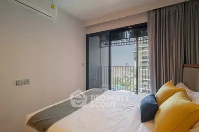 Modern bedroom with balcony view in high-rise apartment