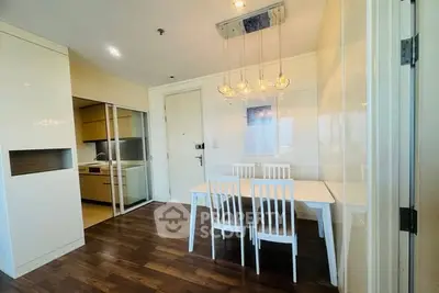 Modern dining area with sleek kitchen in contemporary apartment