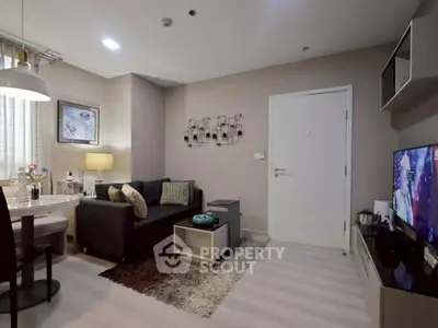 Modern living room with cozy seating and stylish decor in a contemporary apartment.