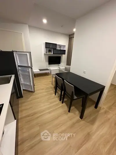 Modern living room with open kitchen and stylish furniture