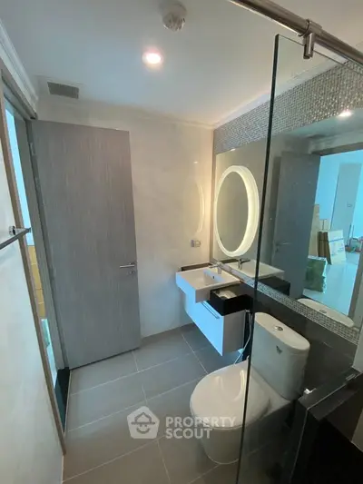 Modern bathroom with sleek design and glass shower enclosure