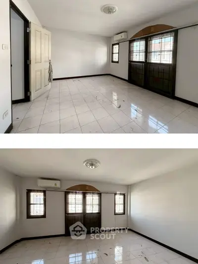 Spacious empty room with large windows and tiled flooring, perfect for customization.