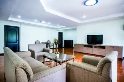 Spacious living room with modern furniture and elegant lighting