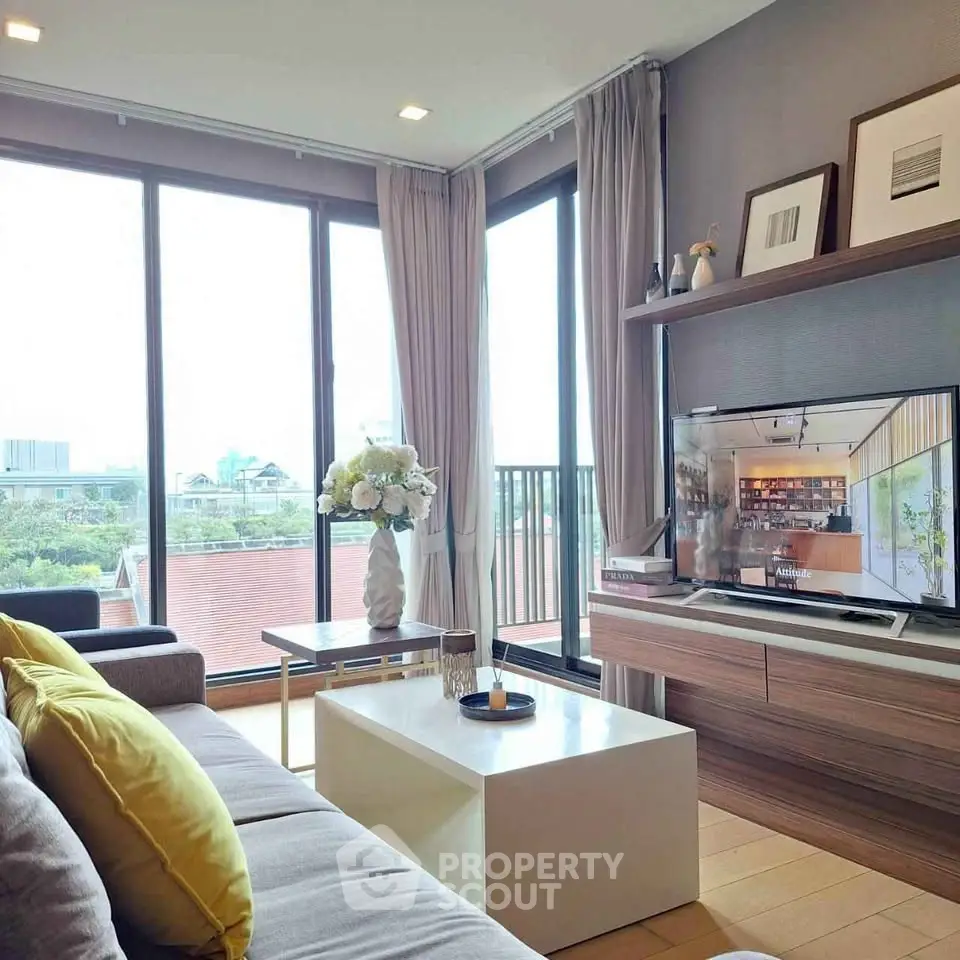 Modern living room with large windows and stylish decor