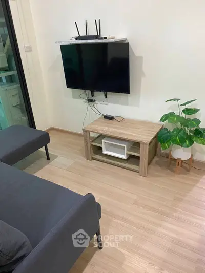 Modern living room with sleek TV setup and stylish furniture