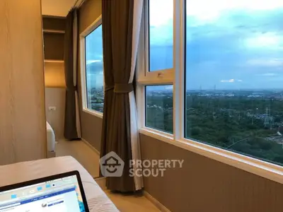 Stunning bedroom with panoramic city view and large windows, perfect for relaxation and enjoying the skyline.