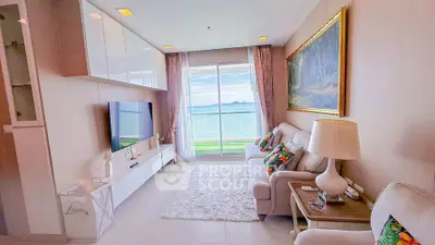 Luxurious living room with stunning ocean view, elegant decor, and modern furnishings in a high-end apartment.