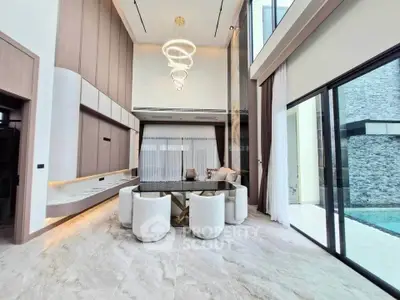 Luxurious modern living room with high ceilings and elegant lighting