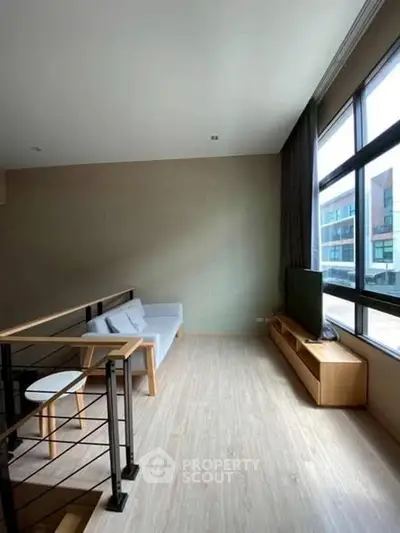 Modern living room with large windows and minimalist furniture