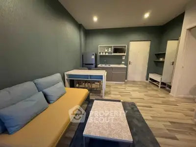 Modern living room with open kitchen layout and stylish decor