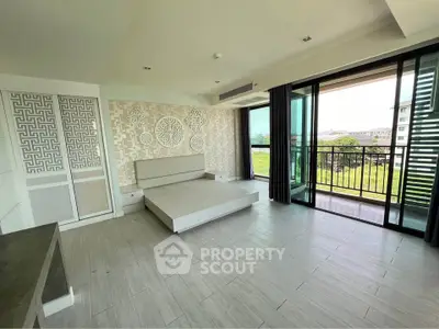 Spacious modern living room with large balcony and stylish decor