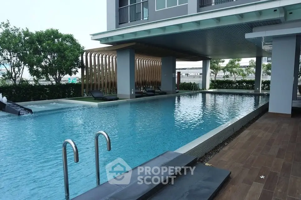Luxurious modern apartment pool area with stylish design and relaxing ambiance.