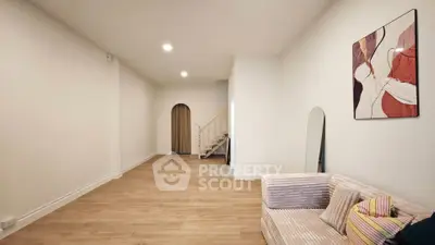 Spacious modern living room with stylish decor and wooden flooring