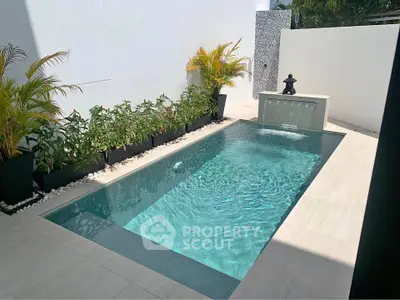 Luxurious private pool with modern design and lush greenery, perfect for relaxation and entertainment.