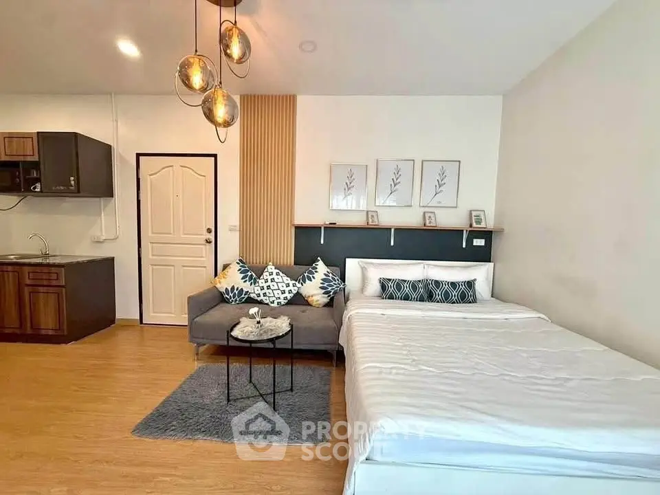 Modern studio apartment with cozy living area and stylish decor