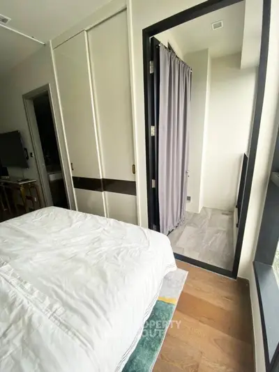 Modern bedroom with balcony access and stylish decor