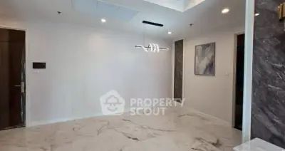 Spacious modern living room with marble flooring and elegant lighting