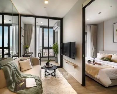 Modern living room with cozy decor and adjacent bedroom in a stylish apartment.