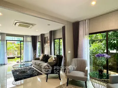 Luxurious living room with modern furniture and garden view