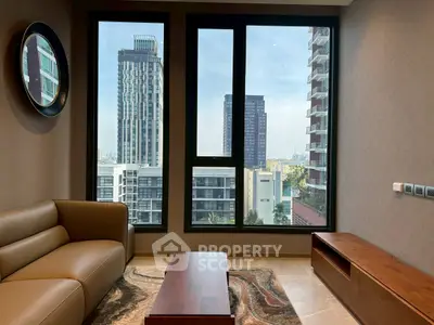 Modern living room with large windows offering stunning city views, featuring a stylish sofa and wooden furniture.