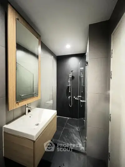 Modern bathroom with sleek design and glass shower enclosure